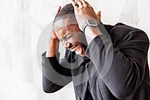 Energized african stylish man listening to vigorous music