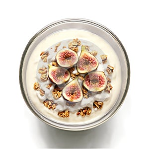 Energizing breakfast bowl with Greek yogurt homemade granola fresh figs and a drizzle of maple photo
