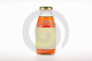 Energizing and invigorating drink product in beautiful transparent glass bottle with blank label of brand advertising for health