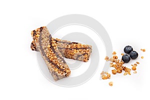 Energy bars with granola and chocolate on a white background