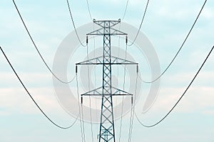 Energy crisis concept, electricity pylon with overhead powerline cables