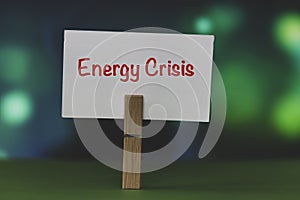 Energy crisis written on white note paper