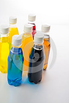 Energy drinks in colorful plastic bottles.