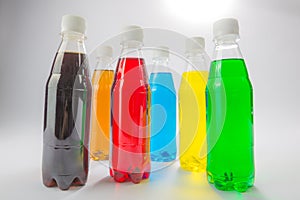 Energy drinks in colorful plastic bottles.