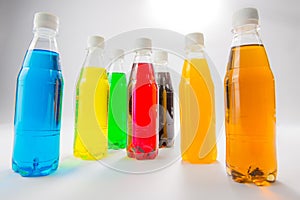 Energy drinks in colorful plastic bottles.