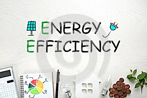 Energy efficiency concept. Flat lay composition with chart and house figure on white background