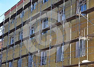 Energy efficiency house wall renovation for energy saving. Exterior house wall heat insulation with mineral wool