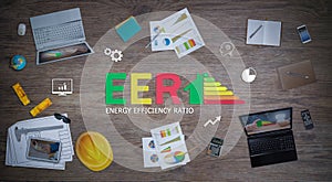 Energy efficiency score graph with office equipment on desk in the planning meeting calculates the home-office energy saving rate