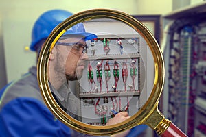 Energy and electricity, electromechanical protective at work with an electric panel, an electrician diagnoses electrical