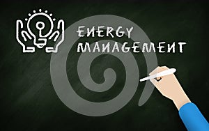 Energy management and Creative Solutions Concept. Symbol of Energy management in chalkboard with writing text and businessman hand