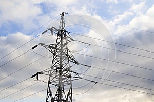 Energy power mast and cloudy sky