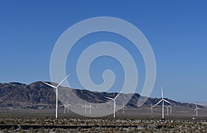 Energy Producing Windmill Farm with mountains