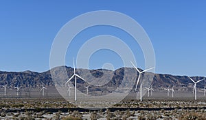 Energy Producing Windmill Farm with mountains