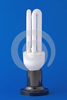 Energy saving bulb on the background