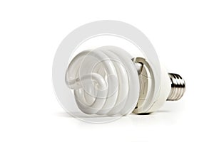 Energy saving fluorescent light bulb on white bakground