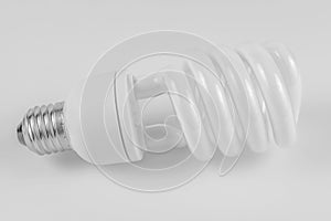 Energy saving fluorescent light bulb on white bakground