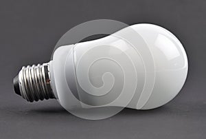 Energy saving lamp on black background