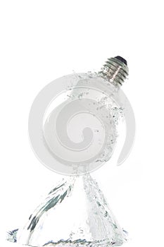 Energy saving light bulb jumping out of the water