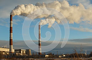 Energy. Smoke from chimney of power plant or station. Industrial landscape.