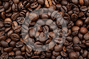 Energy stimulant and smooth java concept with full frame photograph of piled roasting coffee beans backgrounds