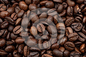 Energy stimulant and smooth java concept with full frame photograph of piled roasting coffee beans backgrounds photo