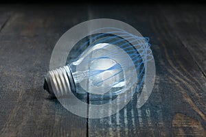 The energy technology of a light bulb that is isolated from blue curved lines and the beauty of wood board fibers