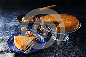 Engadine Walnuts Torte or Buendner Nusstorte on glass plate