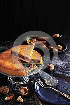 Engadine Walnuts Torte or Buendner Nusstorte on glass plate