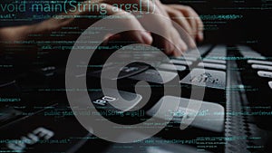 Close-Up of Hands Typing on Computer Keyboard with Programming Code Overlay, Symbolizing Software Development and