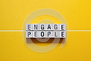 Engage people word concept on cubes
