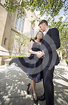 Engaged Couple Outside a Church