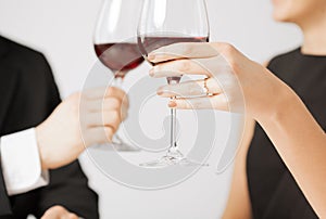 Engaged couple with wine glasses