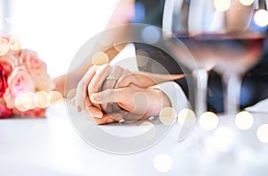 Engaged couple with wine glasses