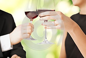 Engaged couple with wine glasses