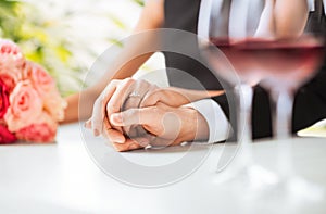 Engaged couple with wine glasses