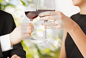 Engaged couple with wine glasses