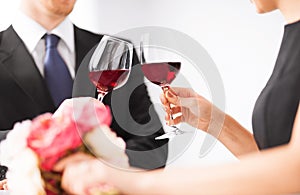 Engaged couple with wine glasses