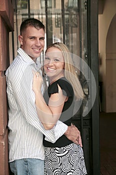 Engaged happy couple holding each