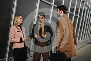 Engaged young professionals in a strategic marketing meeting outdoors