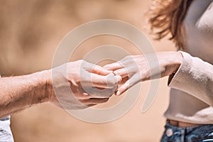 Engagement, proposal and romance while putting a ring on the finger of a woman saying yes to marriage outside. Closeup