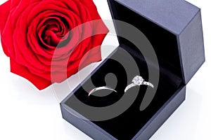 Engagement ring with a bunch of red roses