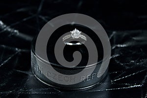 Engagement Ring on hockey puck with the inscription `Czech Republic` on the SILVER background.