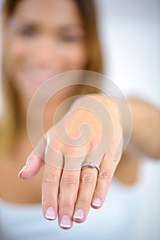 engagement ring on woman hand photo