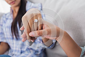 Engagement ring on womans hand photo