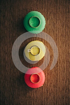 Engagement rings on a colored macaron green yellow and red