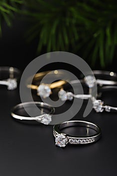 Engagement rings with diamonds on black background. Black friday and Christmas concept