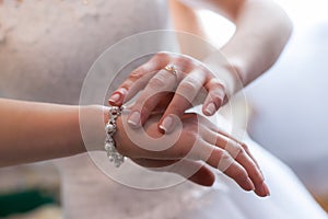 Engagement rings at the hands of the newlyweds