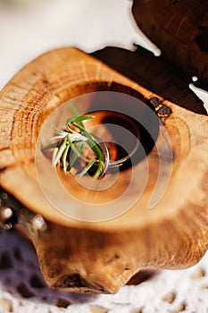 Engagement rings on wood background