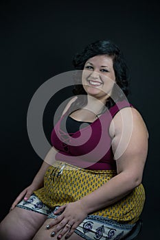 Engaging Portrait of a young woman model against a black backdrop