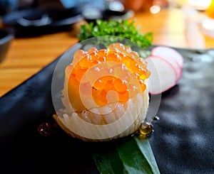 Engawa Sushi Roll topped with Salmon roe. Japanese food